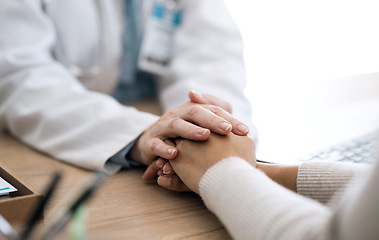 Image showing Hospital, holding hands and doctor with patient for care, comfort and empathy for diagnosis news. Healthcare consulting, clinic and health worker with person for support, wellness and medical results