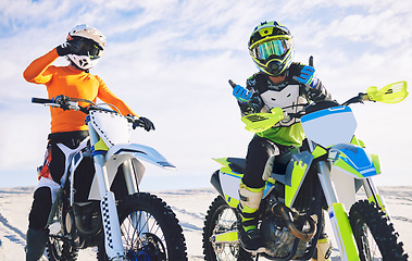 Image showing Moto, rider and portrait in desert for sports with pose after practice for competition. Dubai, people and friends with workout to relax on holiday, vacation or travel for race to win in tournament