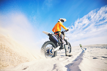 Image showing Desert dust, motorbike and man race outdoor, adventure and travel for extreme sports challenge. Off road, sand and back of driver on motorcycle on dirt in nature for action, competition and freedom