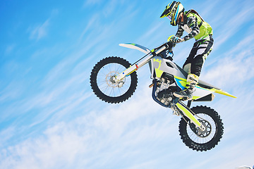 Image showing Training, person and motorbike with sky background, fitness and exercise with competition. Biker, practice and athlete with a bike, sports and health with cycling, travel and freedom with energy