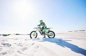 Image showing Desert, motorbike and man outdoor for sport, adventure and travel on mockup space. Offroad, sand and driver on motorcycle on dirt track in nature for action, competition race and thinking of freedom