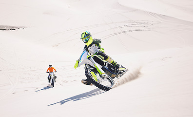 Image showing Motorcycle, desert sand and moto sport with people outdoor on hill with race, journey and adventure. Extreme, workout and motorbike challenge of biker with driving exercise and training in Dubai