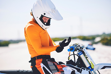 Image showing Motorbike, safety gear and ready for race in desert, training and practice for challenge on sand dunes. Athlete, outdoor and adrenaline in extreme sports, fitness and competition on dirt bike