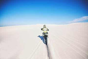 Image showing Desert, back and man on motorbike for sport, adventure and fast travel on mockup space outdoor. Off road, sand and driver riding motorcycle on dirt in nature for action, competition race or freedom