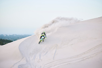 Image showing Motorcycle, desert and race for sports in sand, adrenaline and training for fitness in competition. Athlete, sky and mockup for extreme sport, driving and dirtbike in outdoor for stunt or performance