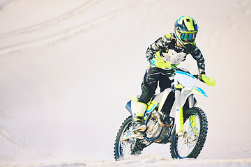 Image showing Driving, motorbike and man on sand for sport, adventure or competition outdoor in summer or mockup space. Motorcycle, ride and athlete on dirt, dune or desert for race, danger and fearless challenge