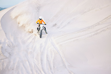 Image showing Motorcycle, desert and extreme sports in race, adrenaline and training for fitness in competition. Athlete, dust and mockup by sand dunes, driving and dirt bike in outdoor for stunt or performance