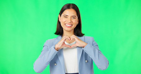 Image showing Portrait, heart hands and woman with green screen, business and kindness on a studio background. Face, happy person and model with promotion, symbol for love and feedback with employee and review