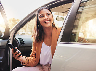 Image showing Thinking, smile and a woman in a car with a phone for communication, social media or the internet. Happy, idea and a young girl in transport or a taxi with a mobile for travel information or update