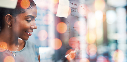 Image showing Happy business woman, writing and schedule planning on glass board with bokeh background at office. Female person or employee smile for agenda, tasks or project plan in startup strategy at workplace