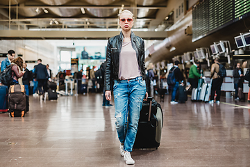 Image showing Female traveller walking airport terminal.