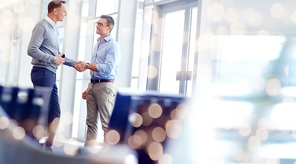 Image showing Business people, handshake and partnership, welcome or negotiation success of deal, agreement or job onboarding. Professional clients shaking hands for meeting introduction in bokeh office or mockup