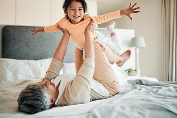 Image showing Woman, girl child and bed for airplane game, portrait and smile with lift, flying and bonding in family home. Senior lady, kid and plane with flight, love and care with freedom, balance and fantasy