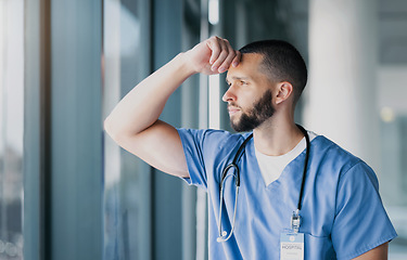 Image showing Window, doctor and man with stress, thinking and mental health with burnout, overworked and depression. Person, employee and medical professional with thoughts, healthcare and anxiety with doubt