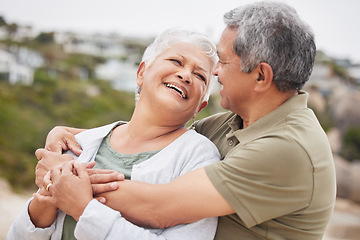 Image showing Senior, couple and hug on beach for travel, vacation or holiday with happiness or relax in nature outdoor. Elderly, man or woman in retirement at ocean or sea for peace, freedom or adventure or smile