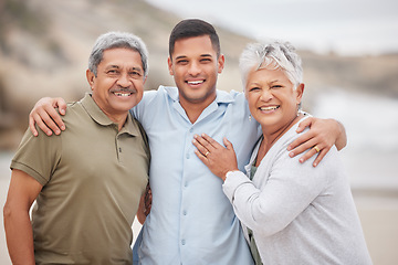 Image showing Man, senior parents or portrait at beach for bond, support or love with smile, care or pride in retirement. Hug, ocean or mature mother with a happy son at sea together on family holiday vacation