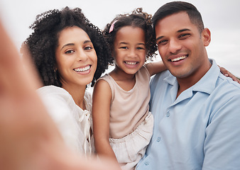 Image showing Selfie, portrait and a family at the beach for memory, bonding or fun on a vacation. Happy, travel and a mother, father and girl kid taking a photo at the ocean for summer freedom, love and care