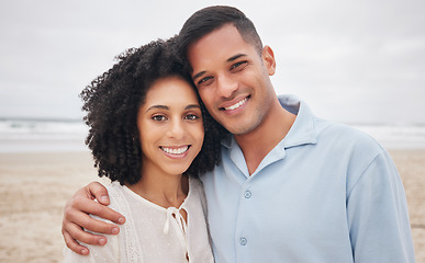 Image showing Couple, hug and portrait by ocean, smile and love in marriage, getaway and holiday for bonding. Mexican people, happy and relax at beach or sea, vacation and travel or trip, summer and peace by waves