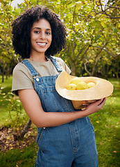Image showing Happy woman in orchard, portrait and agriculture, lemon in nature with healthy food for nutrition on citrus farm. Farmer, picking fruit and smile with harvest, sustainability and organic product