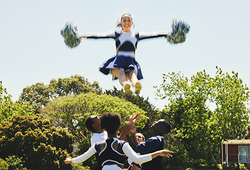 Image showing Cheerleader, jump stunt and sports performance on field with teamwork, trust and collaboration. Team, training and prepare for support competition with gymnastics, energy and skill with excellence