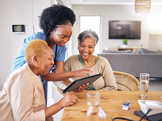 Image showing Tablet, smile and an assisted living nurse with old people in the kitchen of a retirement home for consulting. Technology, medical and an african caregiver showing information to woman friends