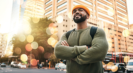 Image showing Happy, man and student with arms crossed in city to travel or commute to university in urban, cbd or town campus. College, person and confident outdoor with smile or relax in street with buildings