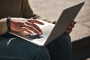 Image showing Laptop, hands and closeup of man typing in the city working on a freelance creative project. Technology, email and male freelancer doing research for planning on a computer by stairs in an urban town