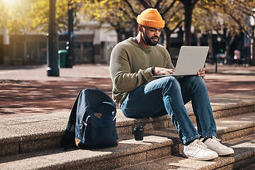 Image showing Student, laptop and outdoor campus for university, college or scholarship research, studying or information on stairs. African man typing on computer for online education, website and e learning FAQ