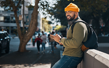 Image showing Student, portrait and phone in city for college, education or e learning chat, communication and social media on campus. African person typing on mobile for scholarship application or contact outdoor