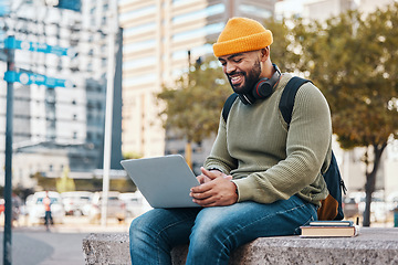 Image showing Student, man and laptop in city for college application, university research or scholarship website information. Happy african person on computer, typing and studying philosophy or language on campus