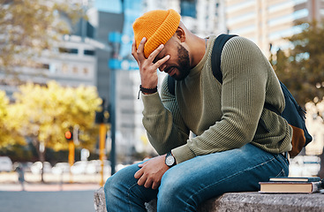 Image showing Stress, headache and student outdoor in college, campus or city with anxiety, crisis or problem in education. Frustrated, man and depression in university from studying, education or fatigue