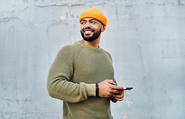 Image showing Phone, smile and young man by wall networking on social media, mobile app or the internet. Technology, happy and male person from Colombia scroll on website with cellphone in city by gray background.