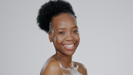 Image showing Face, skincare and smile of black woman in studio isolated on a gray background mockup space. Portrait, natural beauty and cosmetics of African model in spa facial treatment, wellness and skin health