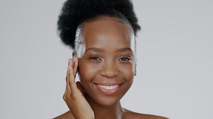 Image showing Face, skincare and hands of happy black woman in studio isolated on gray background mockup space. Portrait, natural cosmetics and African model touch skin in spa facial treatment, wellness or health