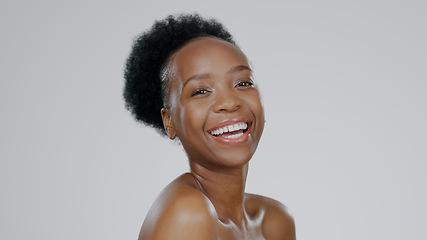 Image showing Face, skincare and beauty of funny black woman in studio isolated on a gray background mockup space. Portrait, natural cosmetics and African model laugh in spa facial treatment, wellness and health