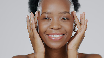 Image showing Face touch, skincare and happy black woman in studio isolated on a gray background for dermatology. Portrait, hands and natural beauty cosmetics of model in spa facial treatment, wellness and health