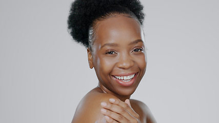 Image showing Portrait, beauty and smile with a happy black woman in studio on a gray background for natural wellness. Skincare, aesthetic or cosmetics with a happy young model closeup for antiaging face treatment