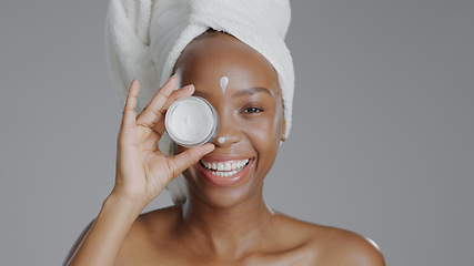 Image showing Woman, moisturizer and smile in portrait for skincare or beauty, health and wellness or dermatology. Happy black person, skin and cosmetics with glow, care and lotion in studio by gray background