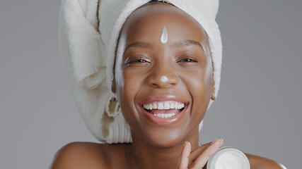 Image showing Woman, moisturizer and smile in portrait for skincare or beauty, health and wellness or dermatology. Happy black person, skin and cosmetics for hydration, care and creme in studio by gray background