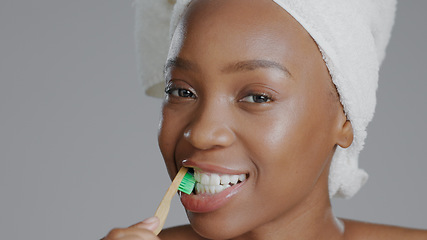 Image showing Portrait, black woman with toothbrush for teeth whitening and dental, health and wellness isolated on grey background. Oral hygiene, orthodontics and clean plaque away with morning routine in studio