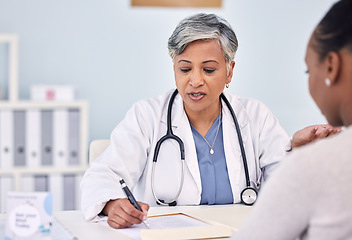 Image showing Senior doctor, patient and writing consultation for prescription, diagnosis or checkup at hospital. Mature female person, medical or healthcare surgeon filling paperwork or life insurance at clinic