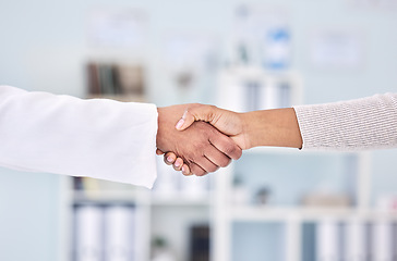 Image showing Doctor, people and handshake in partnership, meeting or deal for healthcare agreement at hospital. Closeup of medical worker shaking hands with patient in thank you, welcome or introduction at clinic