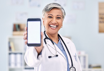 Image showing Phone screen, senior woman and doctor with advertising mockup and portrait, app and ads with telehealth. Social media promo, smartphone and healthcare information on website with smile at clinic