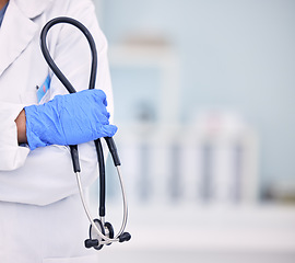 Image showing Doctor, hand and stethoscope of professional with arms crossed for medical or healthcare at hospital. Closeup of nurse or surgeon holding tool or equipment in cardiology, health or wellness at clinic