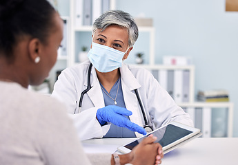 Image showing Senior woman, doctor and tablet for consultation, checkup or diagnosis with mask and patient at hospital. Mature female person, medical nurse or surgeon consulting customer with technology at clinic