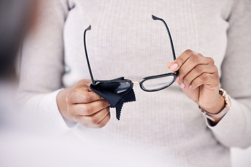 Image showing Person hands, cleaning glasses with cloth and vision, hygiene and maintenance, health and prescription lens with frame. Eyewear, fabric and improve eyesight, eye care and wellness with cleanliness