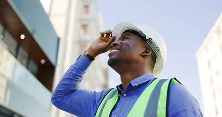 Image showing Happy black man, architect and city with helmet for construction, architecture or building on site. African male person, engineer or engineer smile with hard hat for industrial safety in urban town