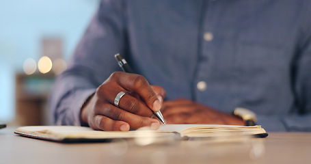 Image showing Businessman, writing and book for schedule planning, ideas or brainstorming strategy on table at office. Closeup of male person, hands or employee taking notes for project plan or agenda at workplace