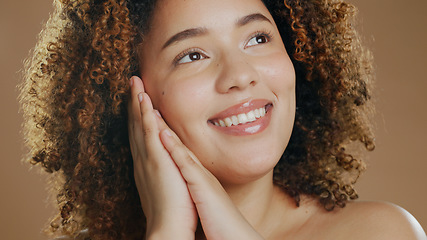 Image showing Thinking, happy woman or natural beauty dermatology for cosmetics or wellness in studio with smile. Skin glow, relax or confident biracial female person with skincare results on a brown background