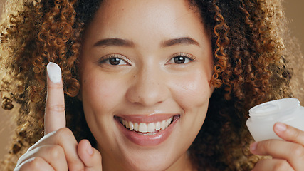 Image showing Black woman, skincare and cream on hand or face for dermatology, beauty or happiness in salon or studio. Skin, care and happy portrait with cosmetics, lotion or sunscreen for wellness and confidence